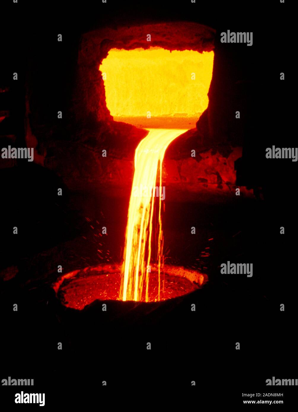Blast furnace. Molten metal pouring from a blast furnace. This furnace