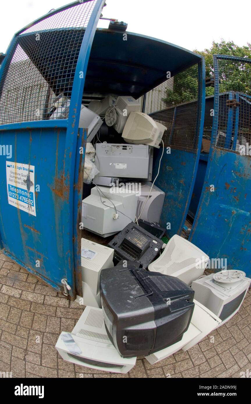 Computer monitor recycling. Discarded computer monitors containing