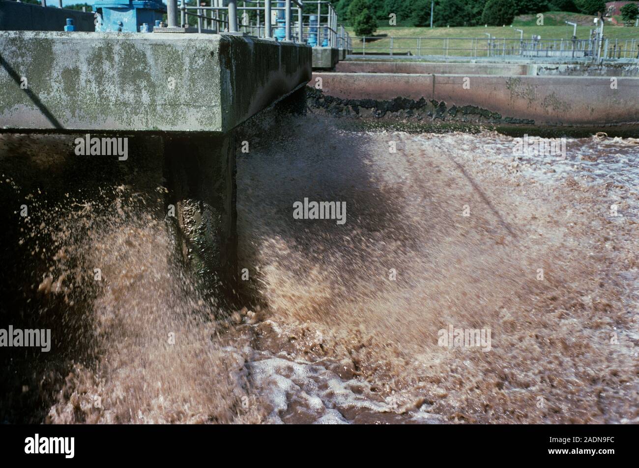 Sewage treatment. Waste water being mechanically stirred during the