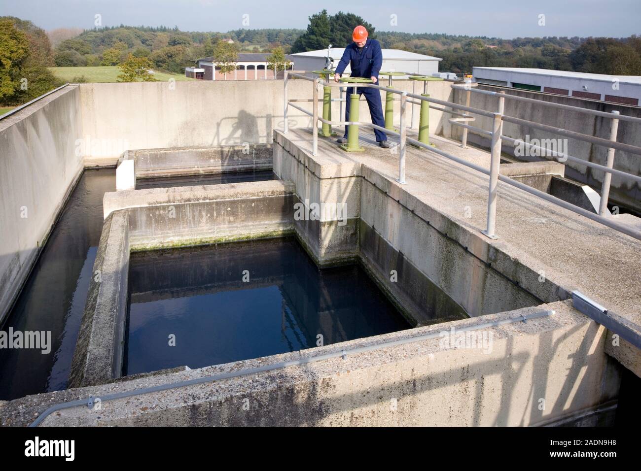 MODEL RELEASED. Water treatment. Worker turning a valve on the flash