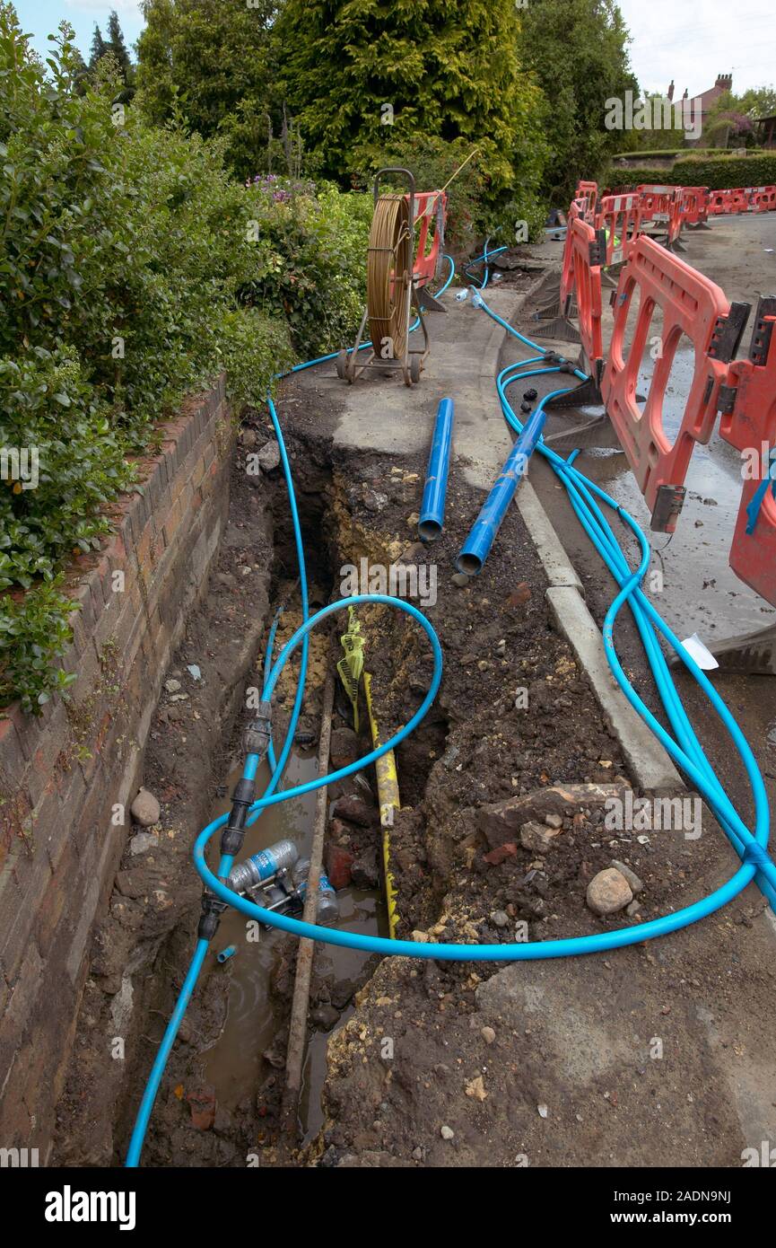 Replacing water mains. Trench with newly replaced water pipes. The