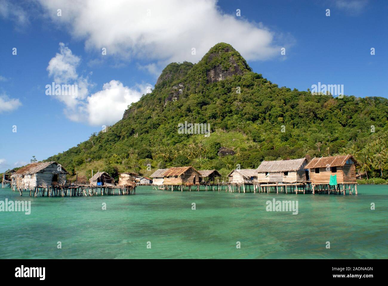 Houses on stilts on a tropical island coast. This island is part of the ...