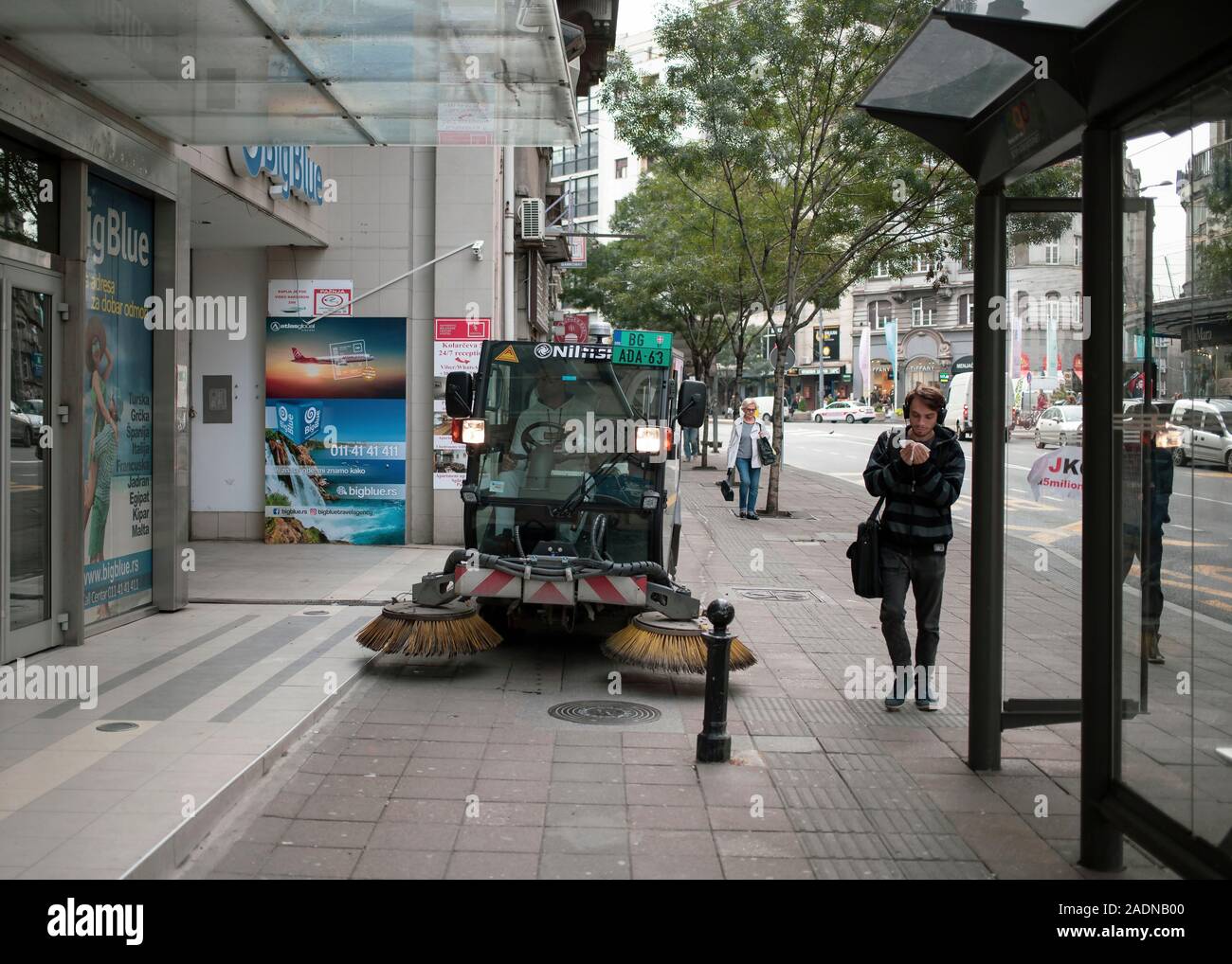 Belgrade, Serbia, Oct 7, 2019: Street sweeper cleaning sidewalk at Terazije square Stock Photo