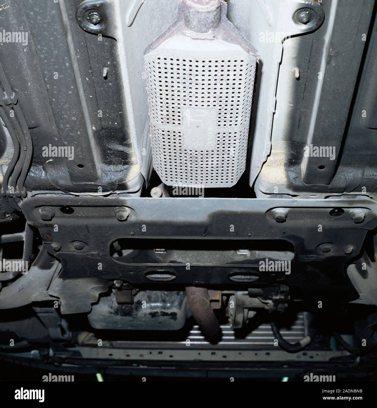 Catalytic converter on the underside of a car. This device reduces the
