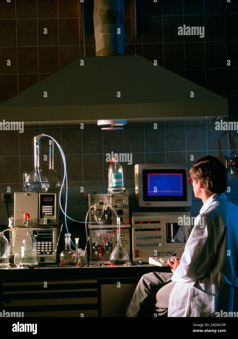 High pressure liquid chromatography. Chemist using High Pressure Liquid Chromatography (HPLC