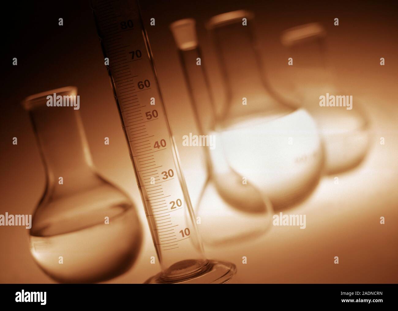 Laboratory glassware. Roundbottomed flasks and a measuring cylinder