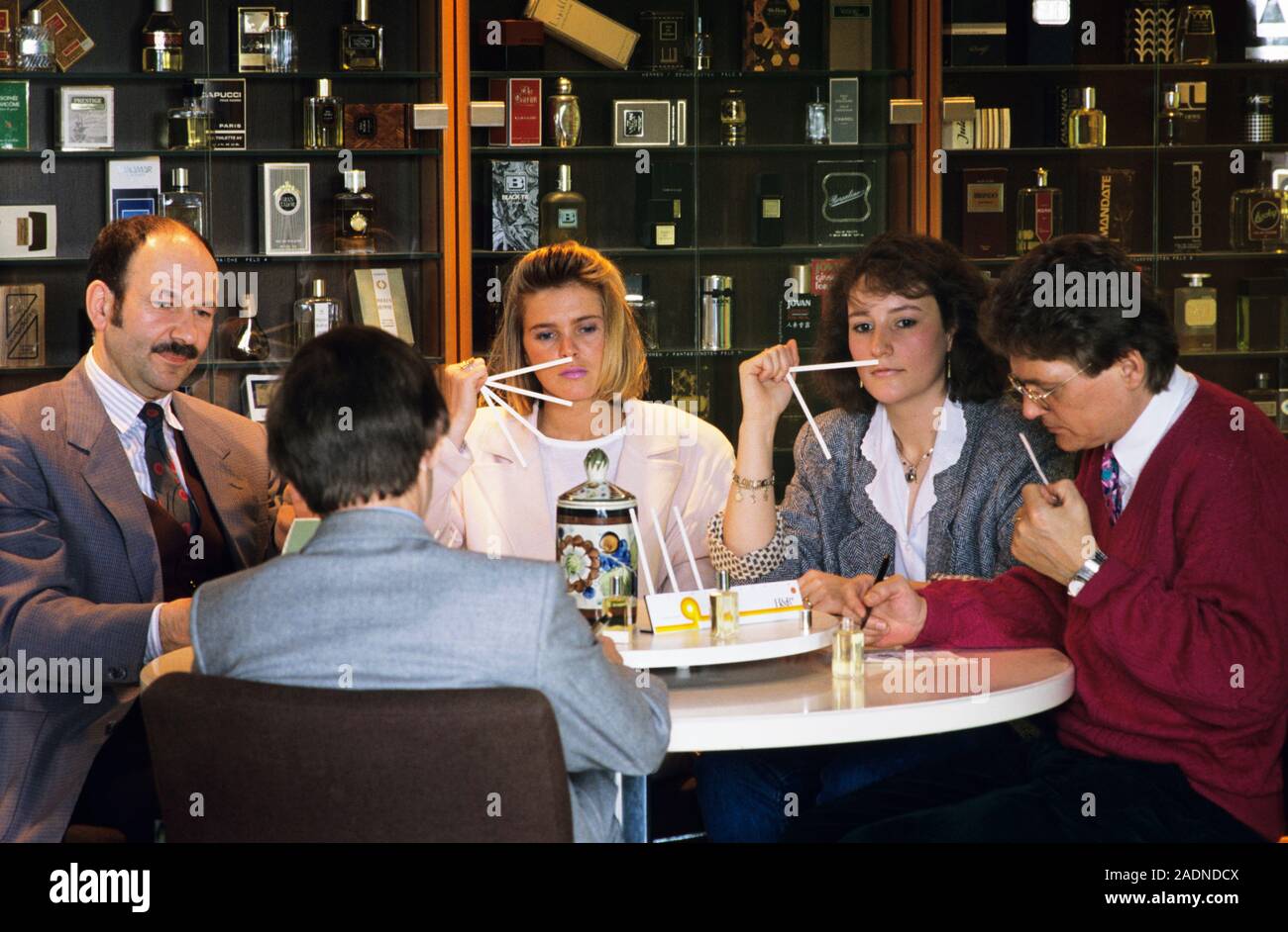 Perfume testers sniffing samples of perfumes during the creation of a ...