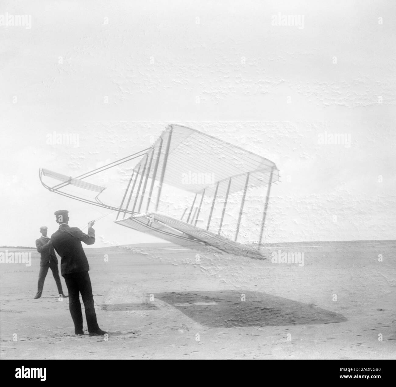 Wright brothers testing a glider. Orville (foreground) & Wilbur