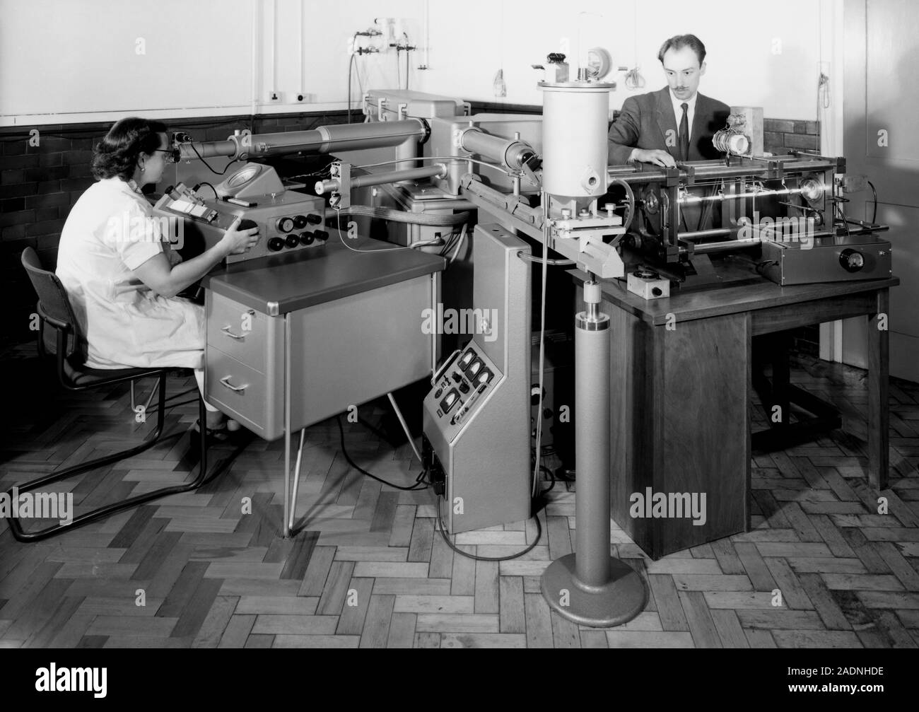 Woman Using Comparator One-metre interference comparator. Researchers using the interference ...