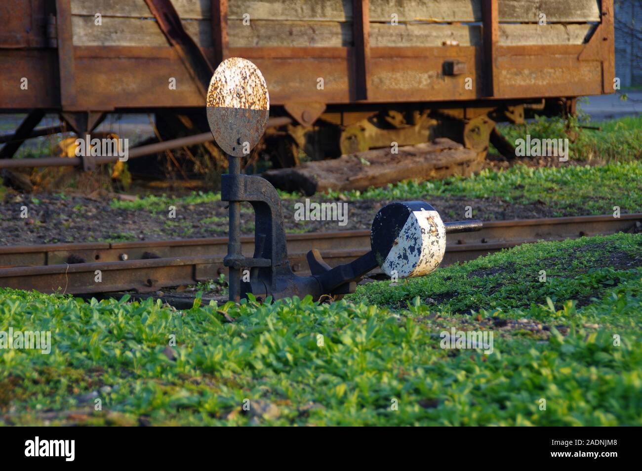 Old railway switch. Rusty handle reversing the train direction. Stock Photo