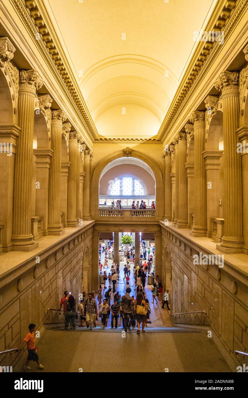 Lot of people and Tourists walk inside the Metropolitan Museum of Art, the largest art museum in