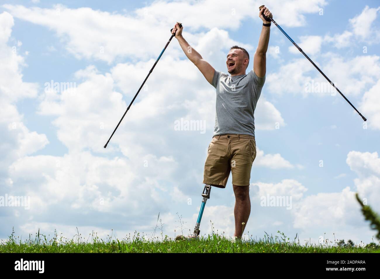 Elated young man with disability feeling happy Stock Photo