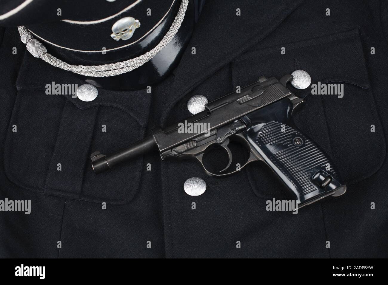 WWII era nazi german waffen SS black uniform 1930 year pattern and army handgun Stock Photo