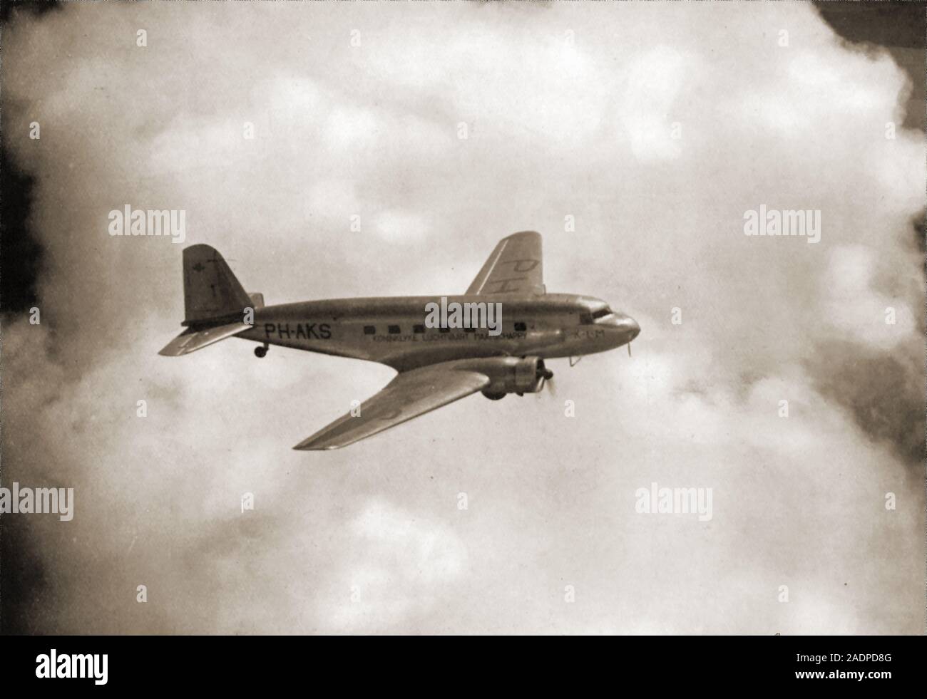 A  vintage 1936 photograph of a Sperwer (Sparrow Hawk) KLM passenger plane in flight on the Amsterdam to Batavia (Jakarta)  Route Stock Photo