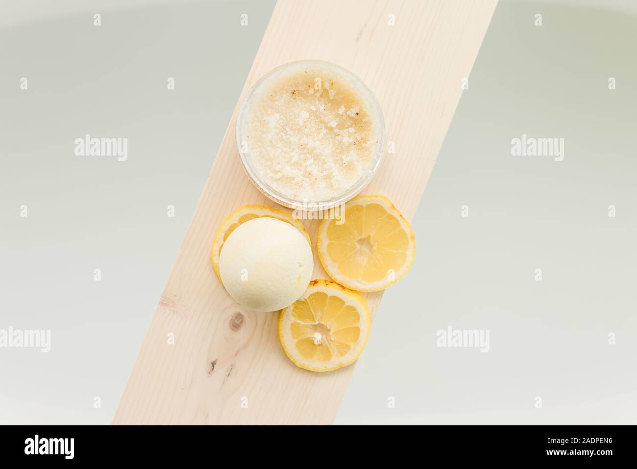 lemon bath with bath bomb and real lemons Stock Photo