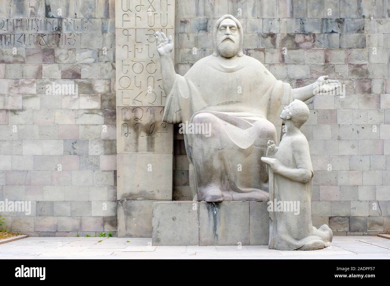 Statue of Mesrop Mashtots, inventor of the Armenian alphabet, and his disciple Koryun in front of the Matenadaran, Yerevan, Armenia. Stock Photo