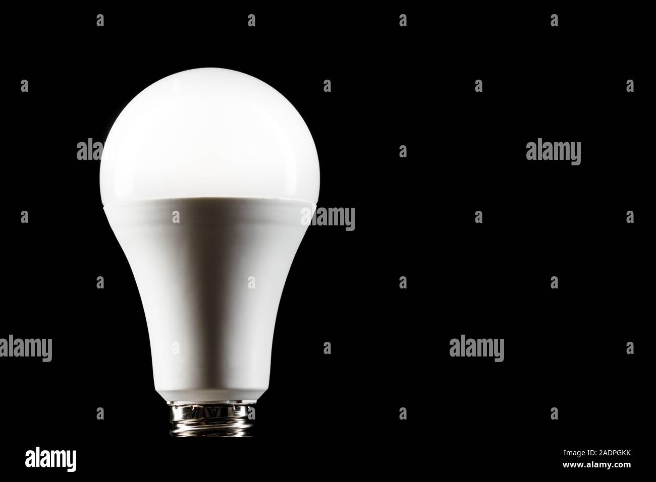 Energy saving light bulb on black background. LED light bulb Stock ...