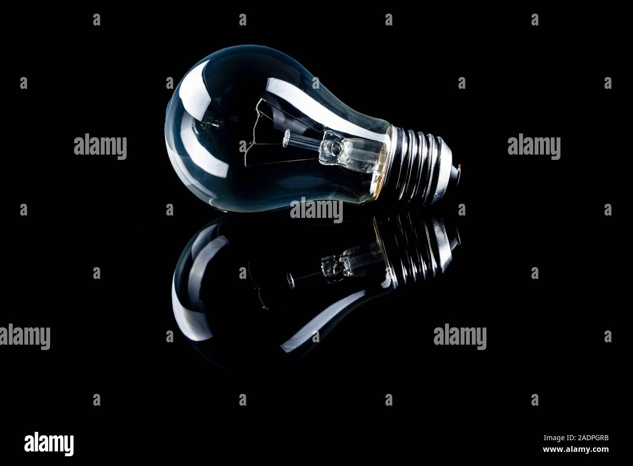 Classic light bulb on black background Stock Photo Alamy