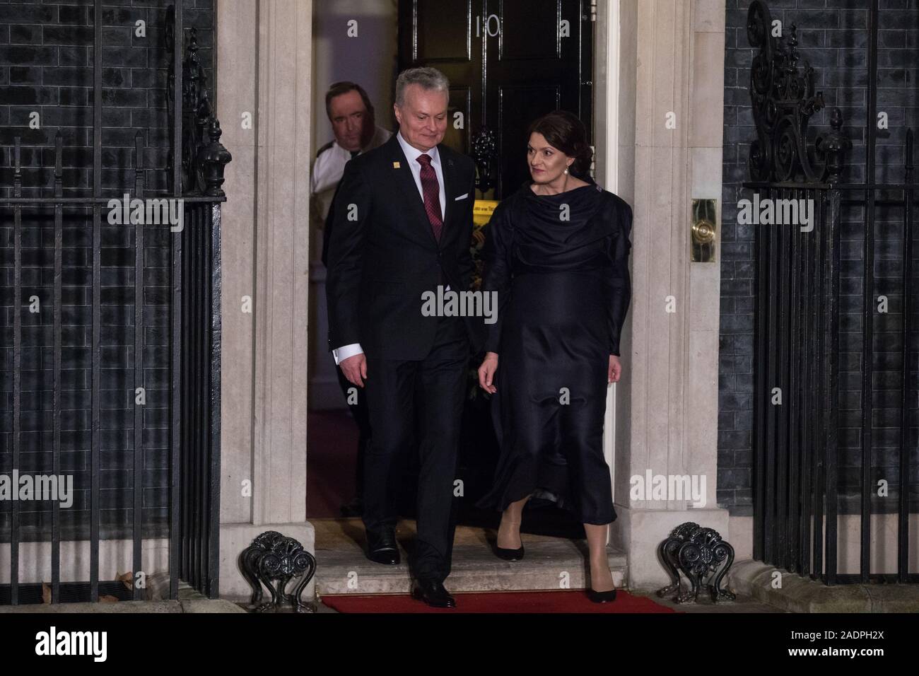 London, UK. 3 December, 2019. Gitanas Nausėda, President of Lithuania, leaves with his wife Diana Nausėdienė following a reception for NATO leaders at 10 Downing Street on the eve of the military alliance’s 70th anniversary summit at a luxury hotel near Watford. Credit: Mark Kerrison/Alamy Live News Stock Photo