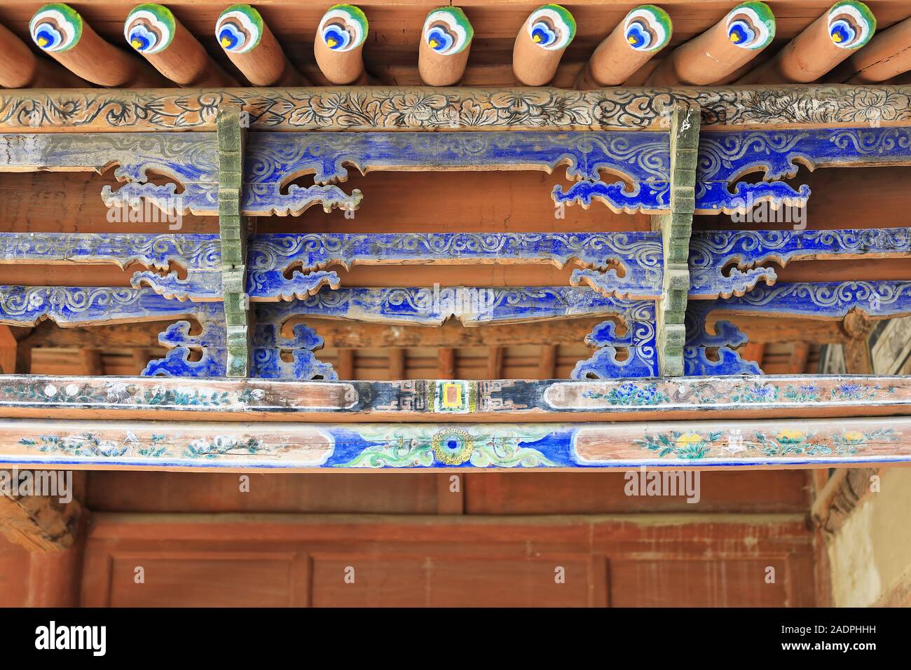 Polychrome structural timber beams-wooden porch. Mogao Buddhist caves-Dunhuang-Gansu-China-0644 Stock Photo