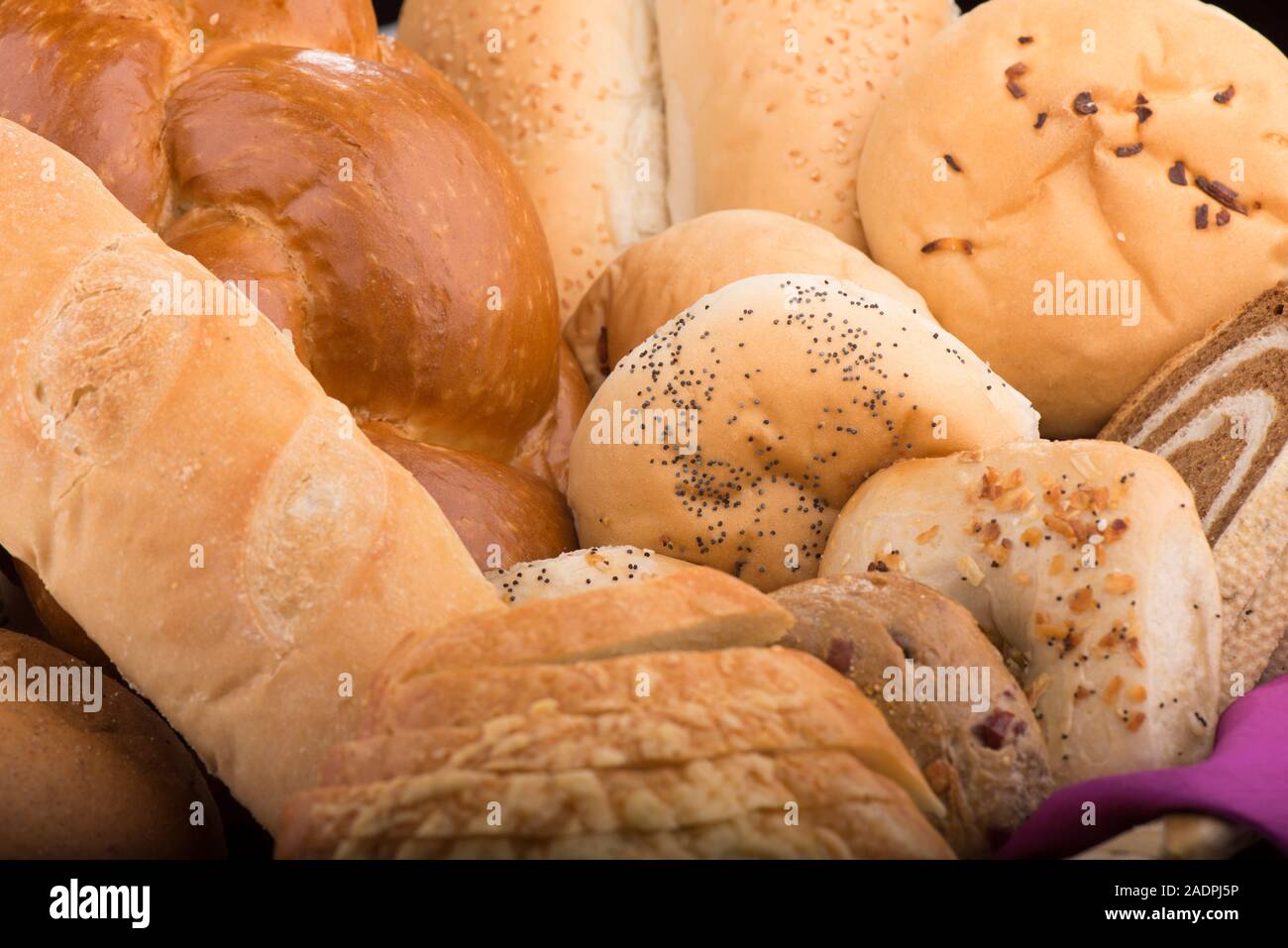 Assortment of Freshly baked bread and other bakery items Stock Photo