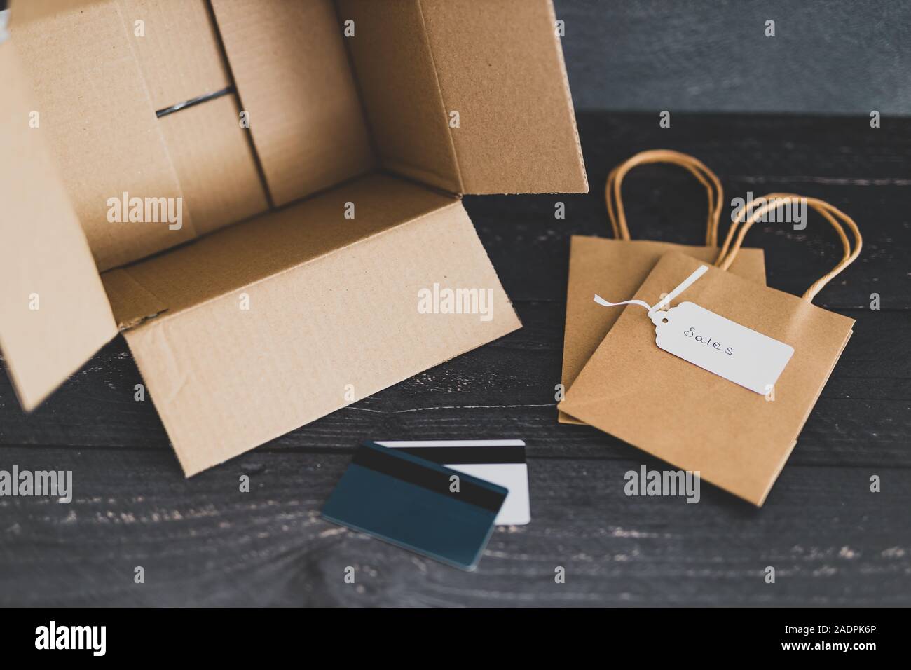 online shopping conceptual still-life, open empty parcel with shopping ...
