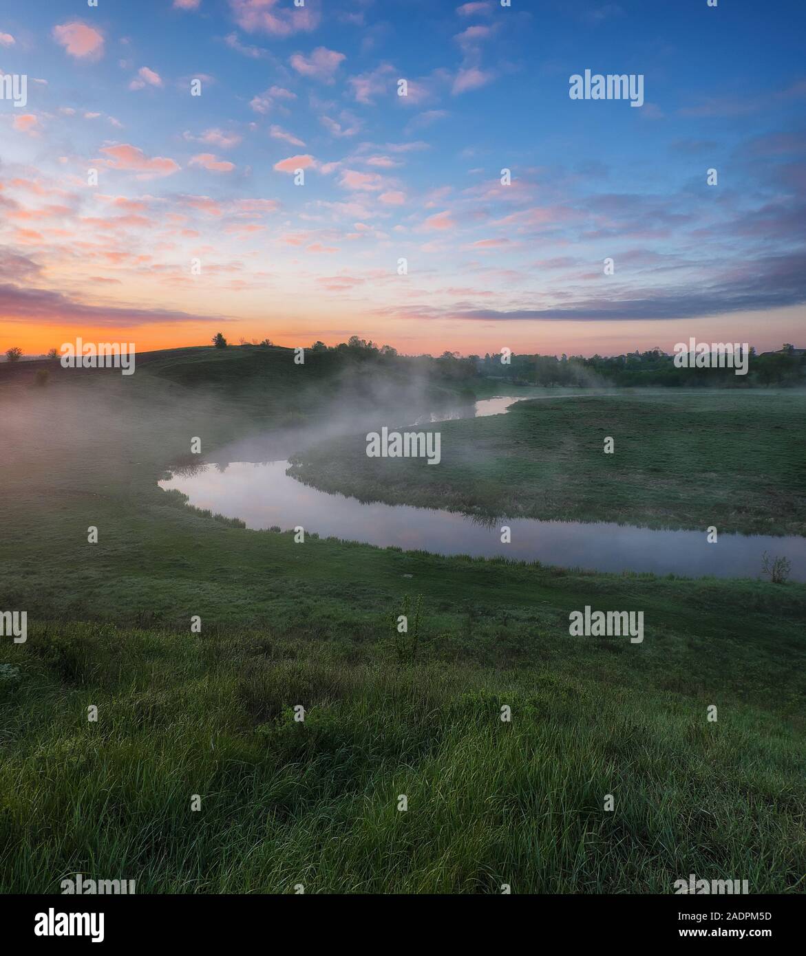 fog in the river valley. picturesque spring morning. beautiful foggy sunrise in a foggy meadow Stock Photo