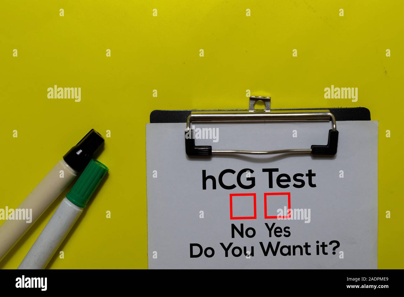 hCG Test, Do You Want it? Yes or No. On office desk background Stock Photo