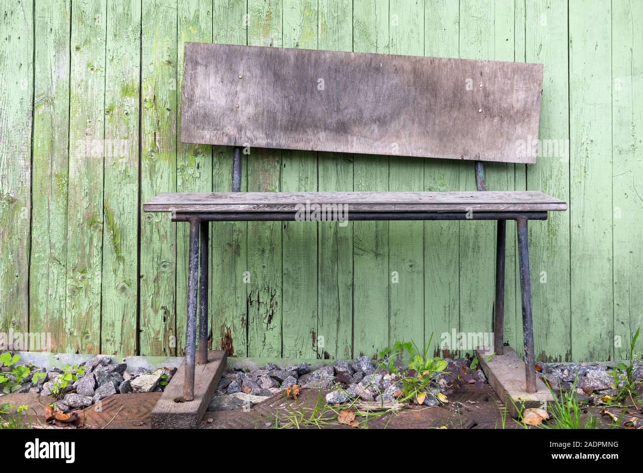Empty old garden weathered bench against wooden wall Stock Photo - Alamy