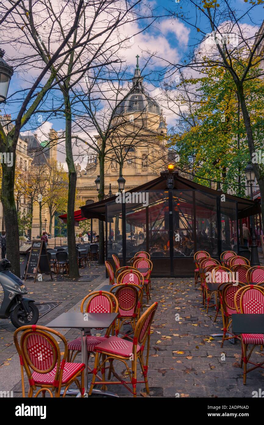 Paris, France - November 7, 2019: Typical french terrace bar in the square, in front of the chapel of the Sorbonne University. Stock Photo