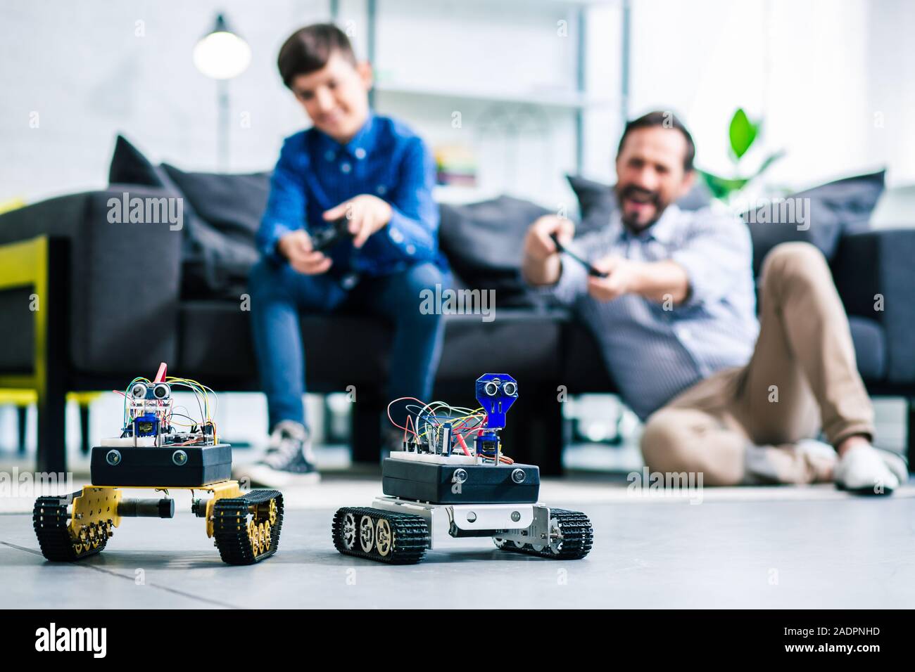 Selective focus of robotic devices standing on the floor Stock Photo