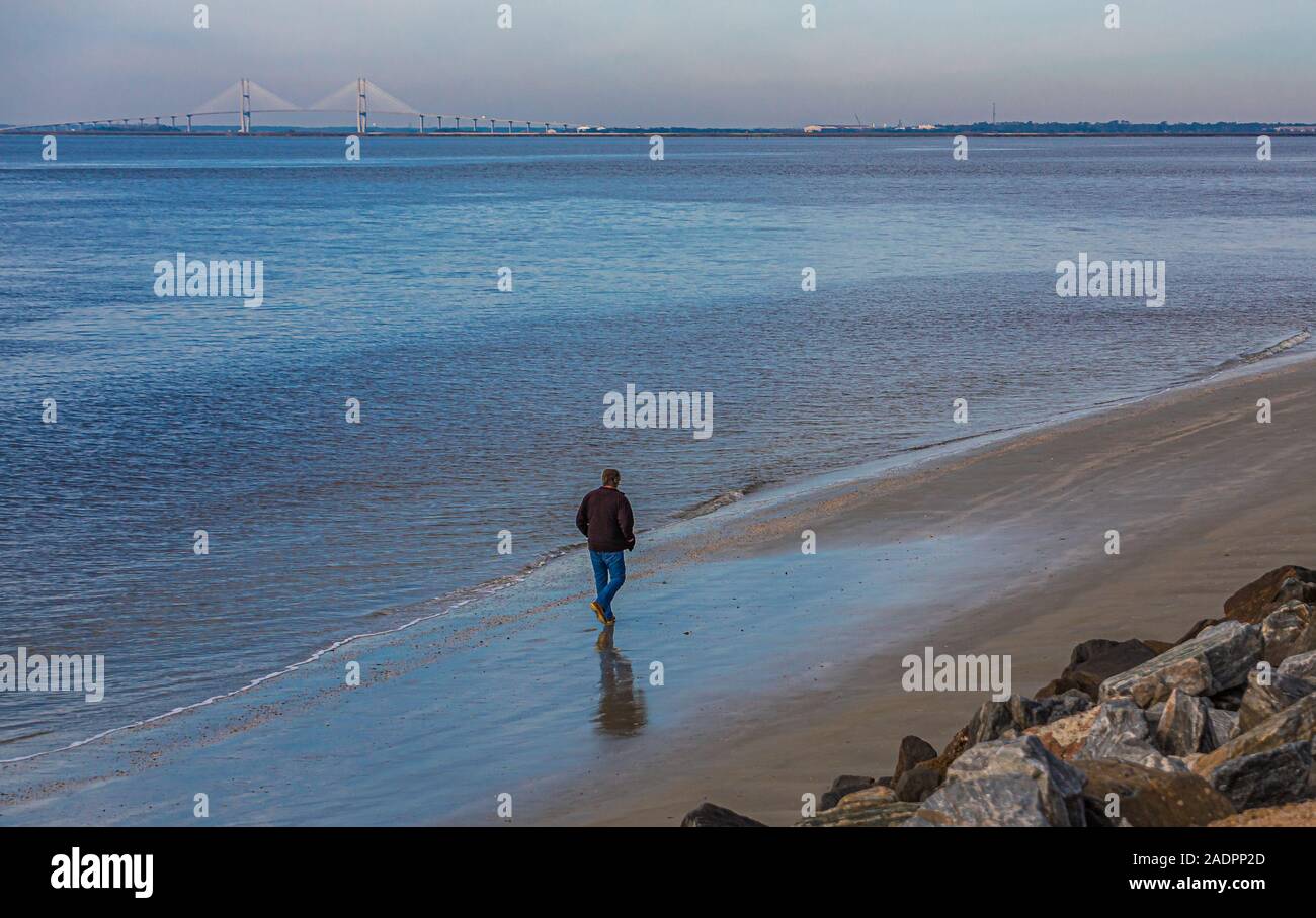 Man walking on beach hi-res stock photography and images - Alamy