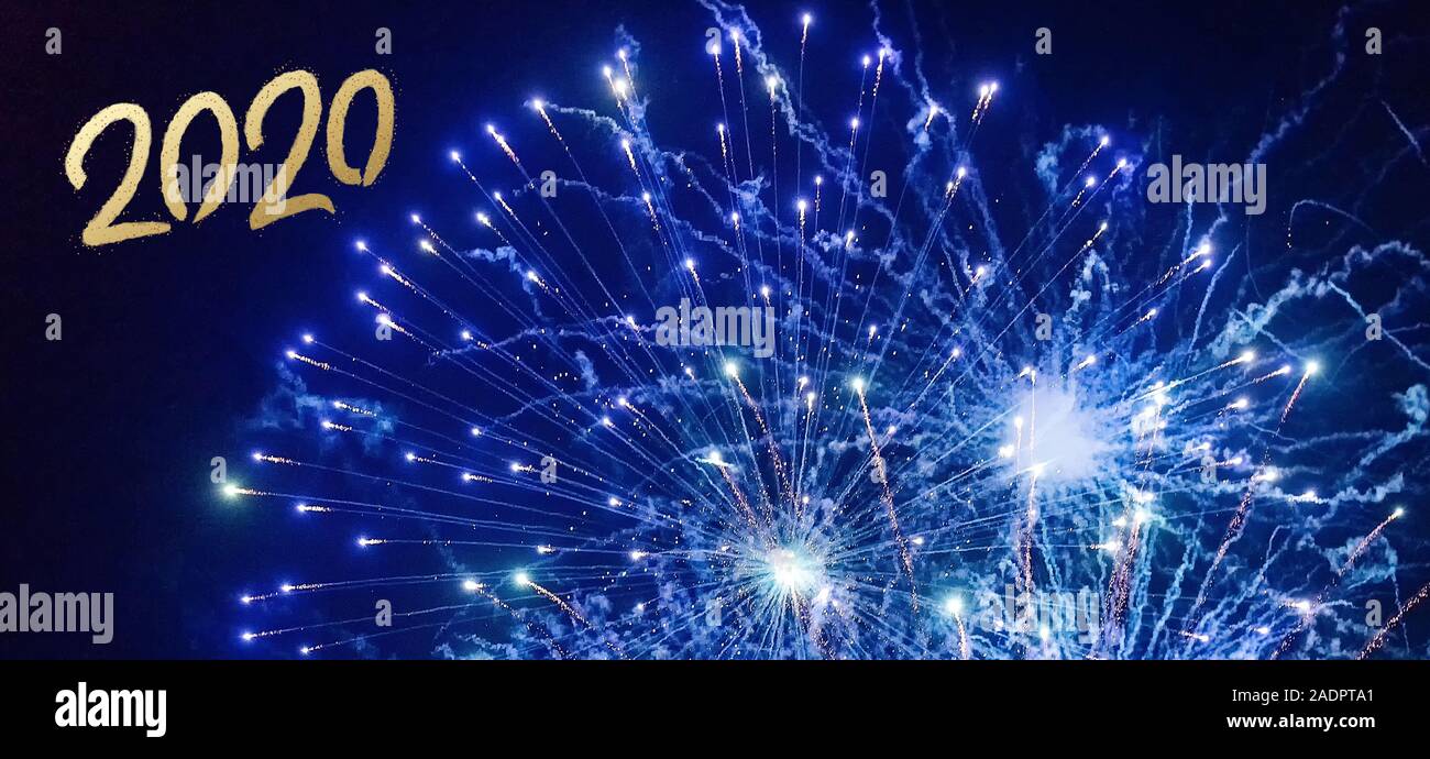 2020 Text with Festive blue Fireworks Collage in Night Sky. Happy new ...