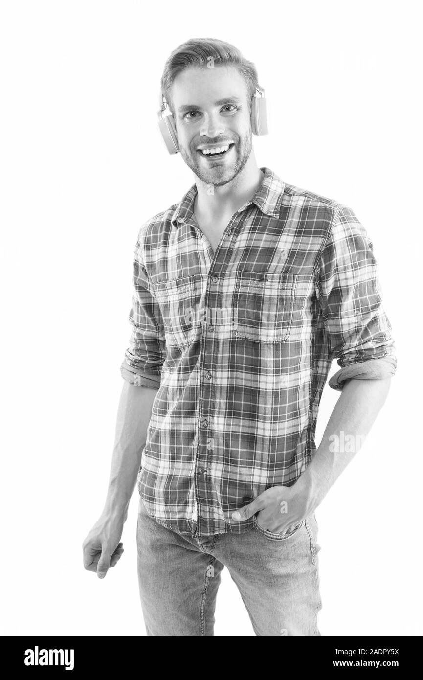 Good mood. Man listening music wireless headphones. Hipster headphones gadget. Rhythm of life. Unshaved handsome guy enjoy music. Music fan concept. Music playlist for daily life. Positive vibes. Stock Photo