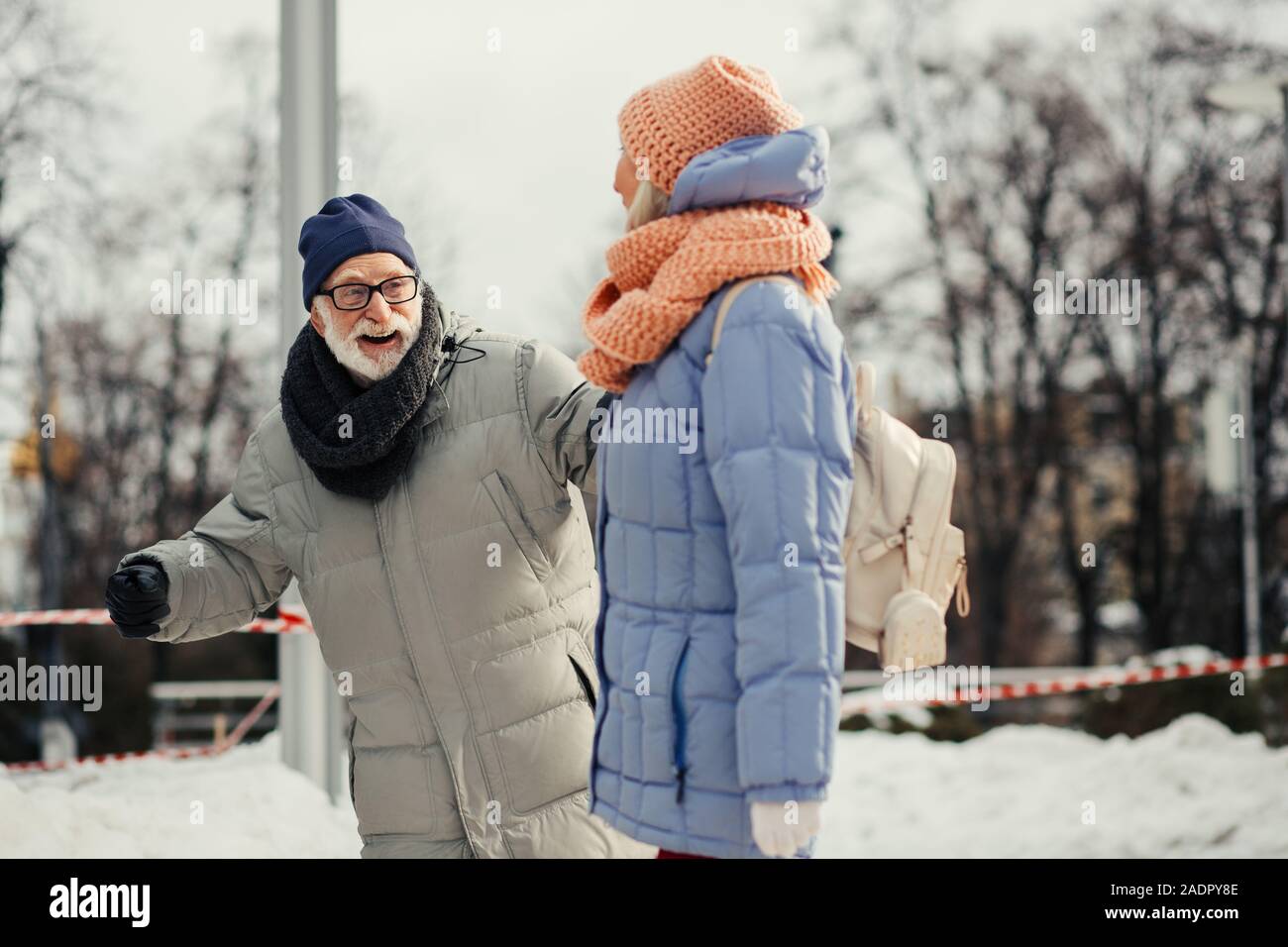 Elderly couple smiling while having fun outdoors Stock Photo