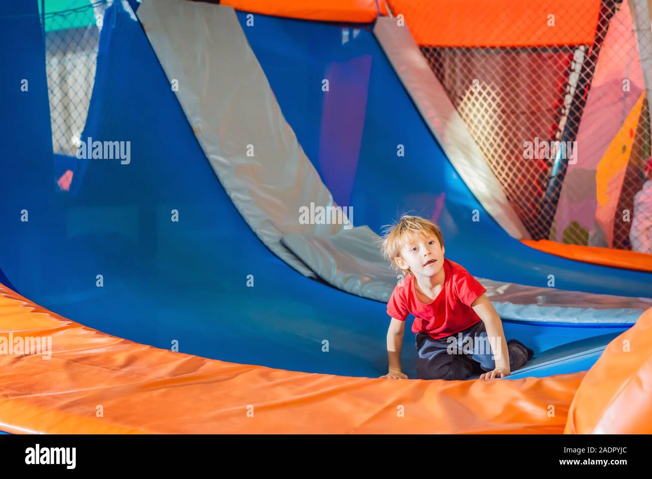 Little boy have fun jumping on trampolines Stock Photo - Alamy