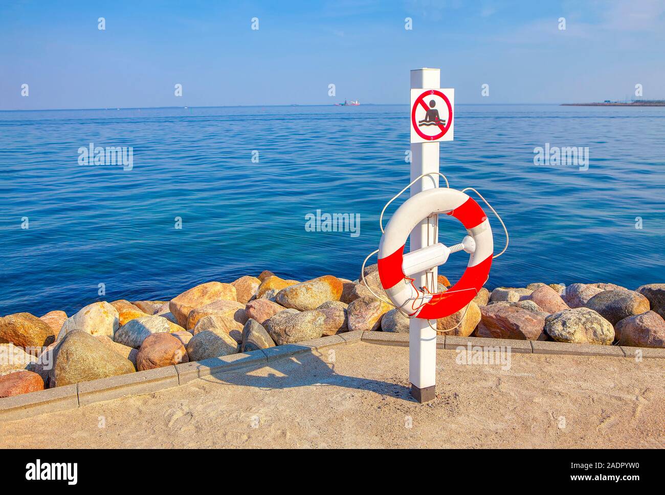 warning sign on the sea shore Stock Photo
