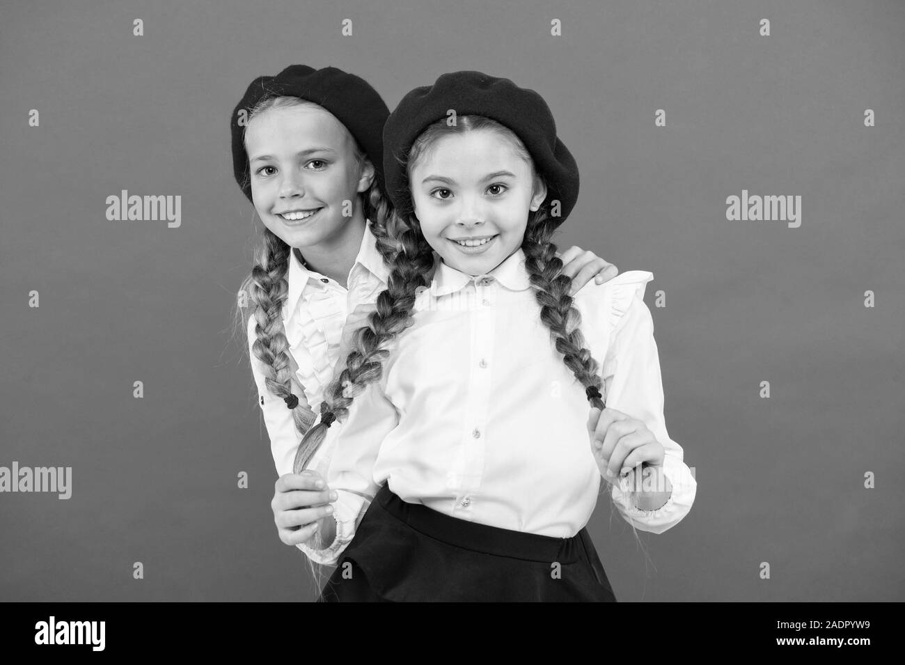 Our friendship will last forever. Adorable small friends smiling on pink background. Happy schoolgirls enjoying friendship. Little children celebrating friendship day. Bonds of friendship. Stock Photo