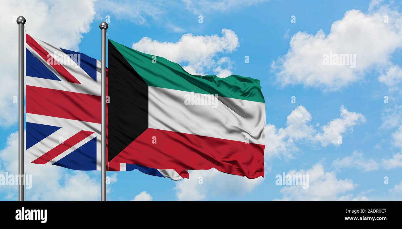 United Kingdom and Kuwait flag waving in the wind against white cloudy blue sky together. Diplomacy concept, international relations. Stock Photo