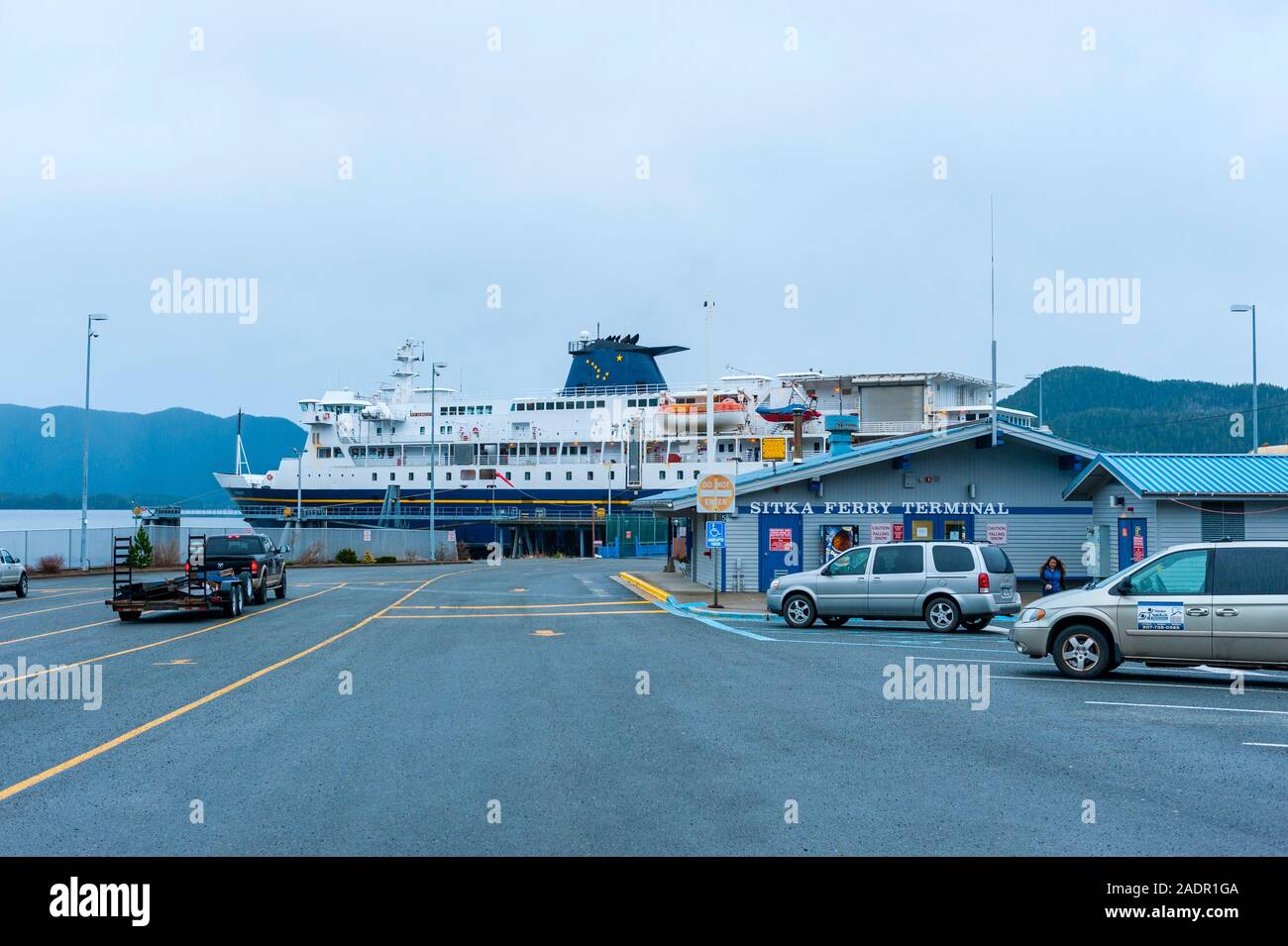 Vehicles lining up to board the M/V Kennicott docked at the Sitka Terminal. Sitka, Alaska, USA. Stock Photo