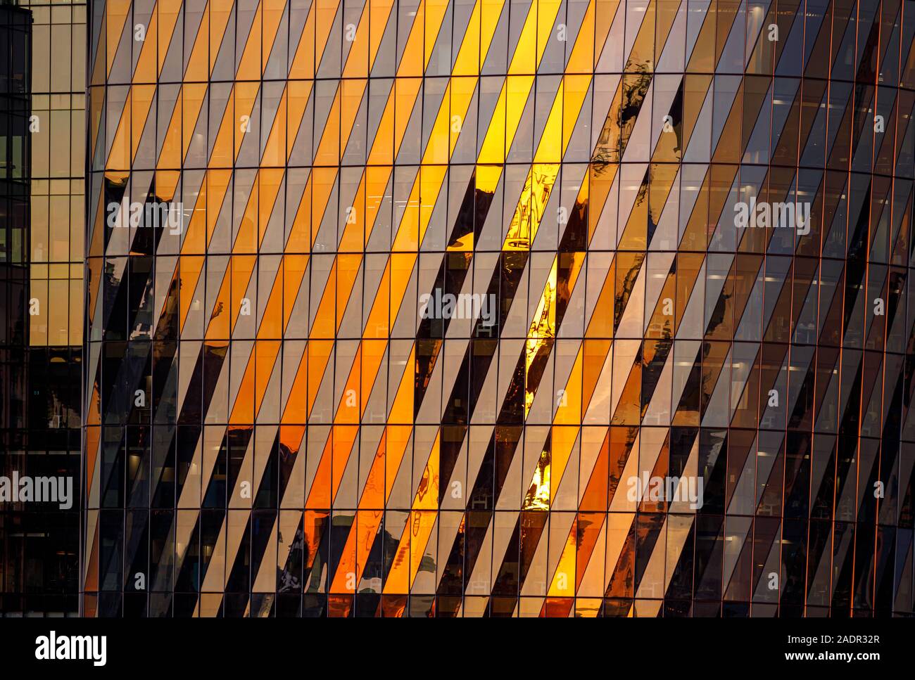 Reflections off the windows during sunset at Collins Square Tower 5 Stock Photo