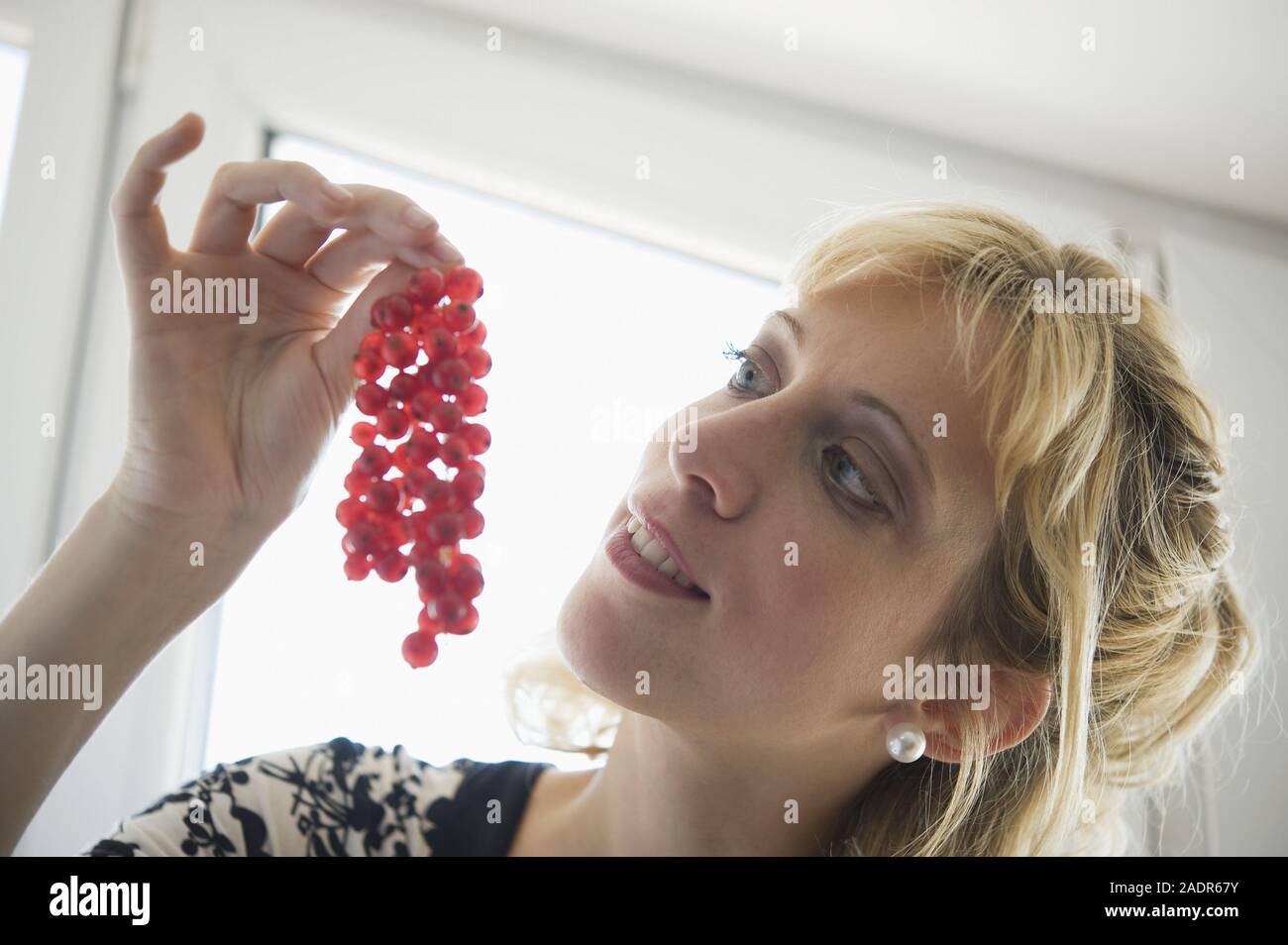 Junge Frau mit Beeren - Young Woman with Berries Stock Photo