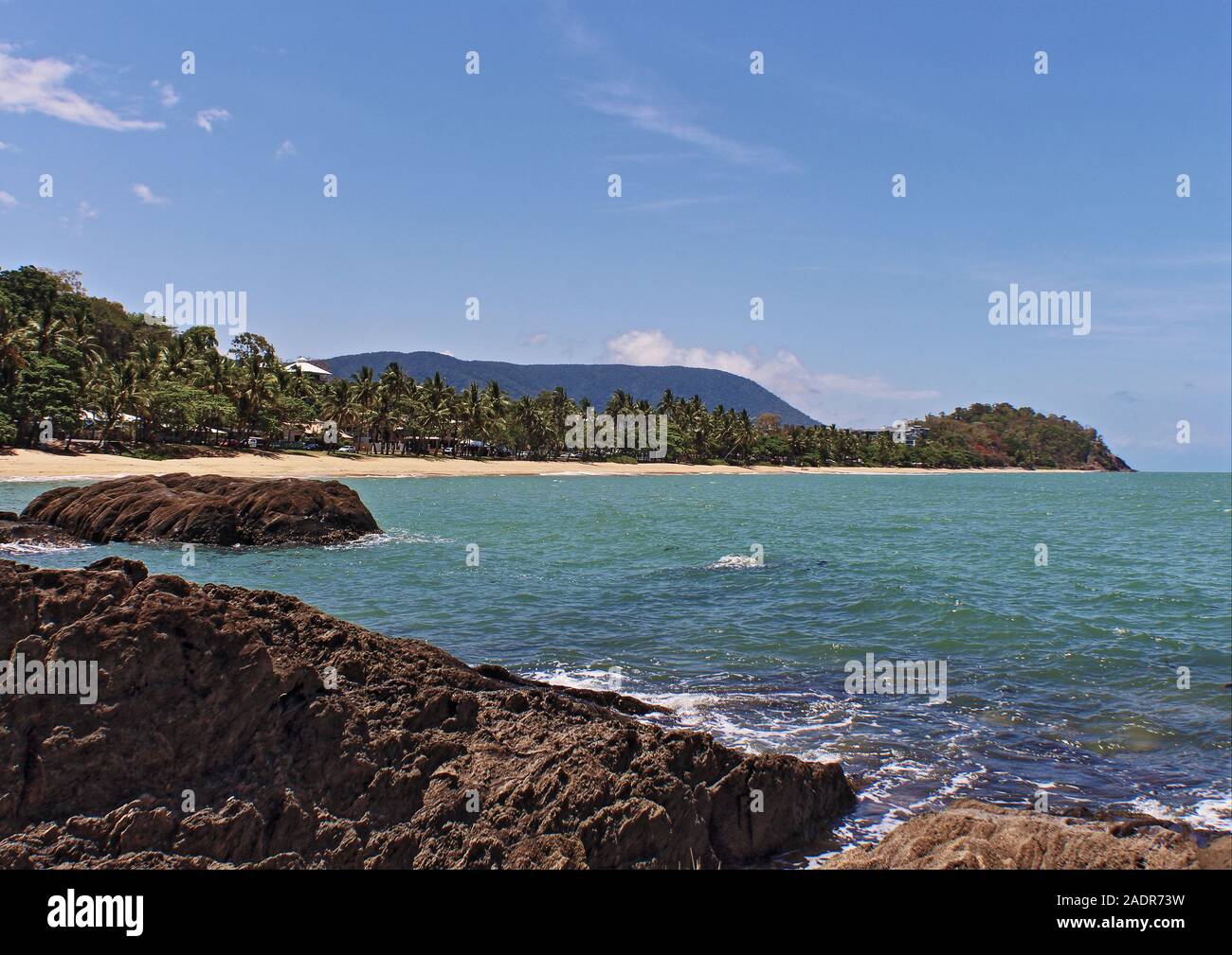 The inside Trinity Beach cove view that shows off a favorite local's beach in Cairns QLD Australia Stock Photo