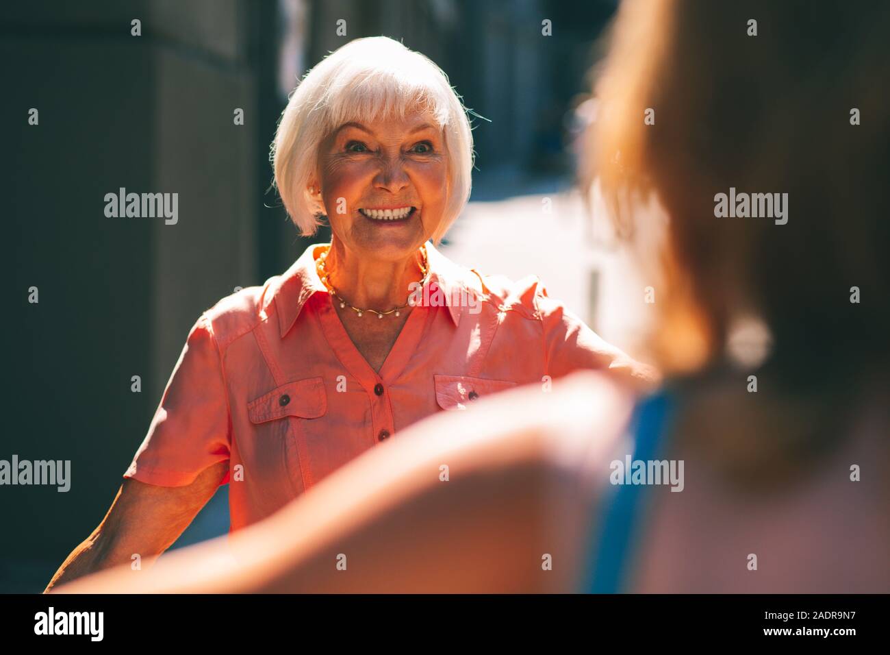Looking excited when meeting in the street stock photo Stock Photo