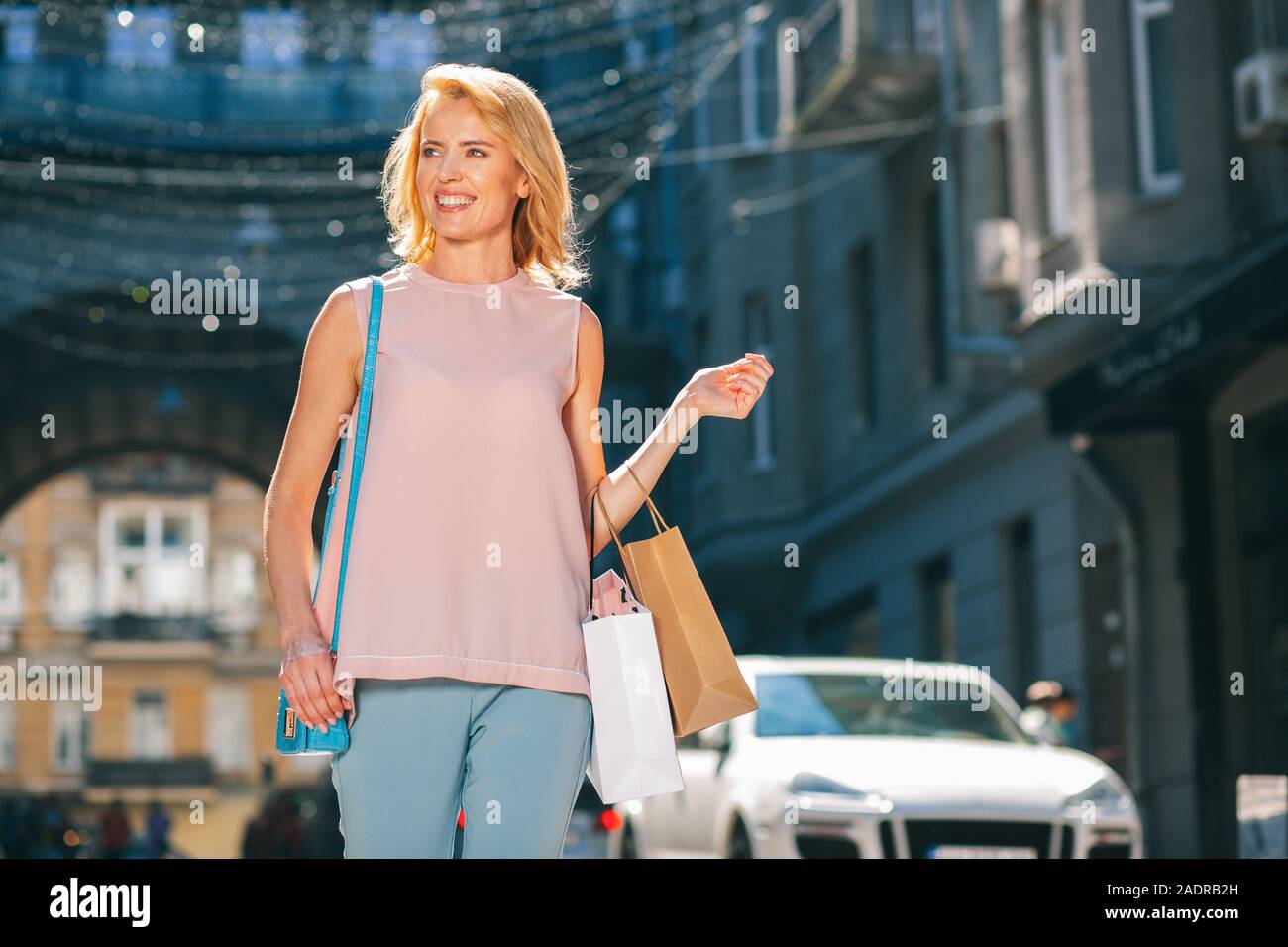 Gladsome lady enjoying shopping in summer stock photo Stock Photo
