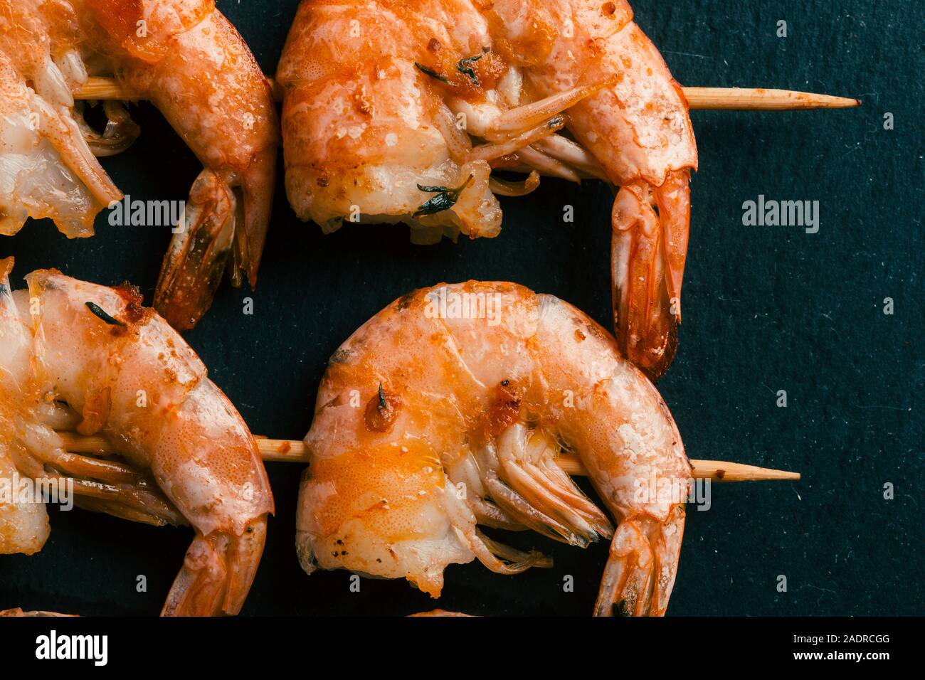 Crispy crust of fried prawns on black slate Stock Photo