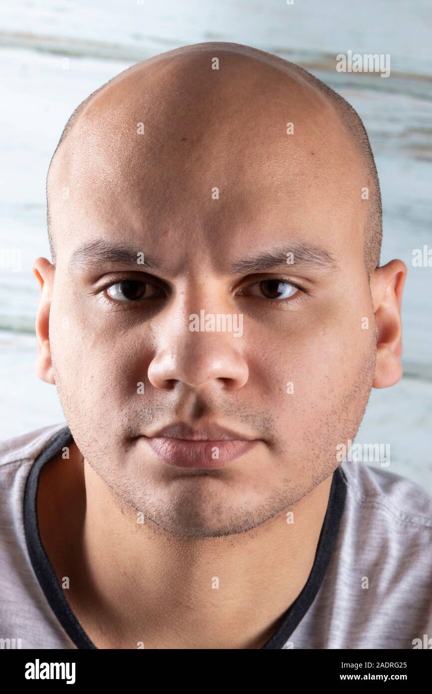 Attractive bald man looking at camera Stock Photo