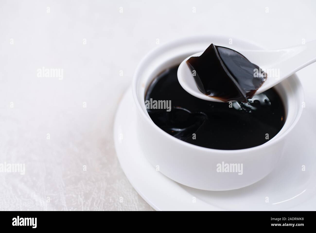 Grass jelly It's Southeast Asia Dessert made from made by boiling the aged and slightly oxidized stalks. Stock Photo