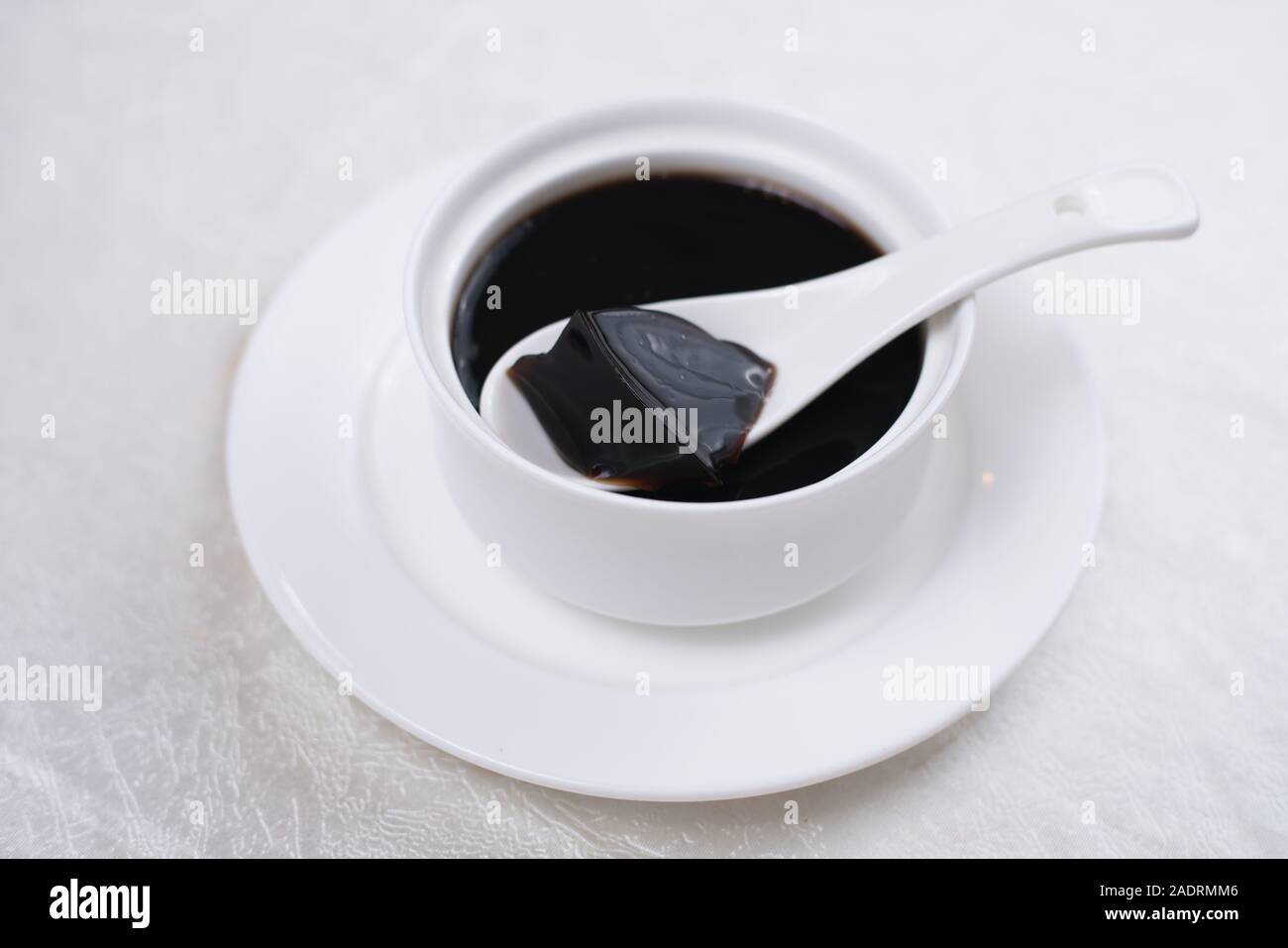 Grass jelly It's Southeast Asia Dessert made from made by boiling the aged and slightly oxidized stalks. Stock Photo