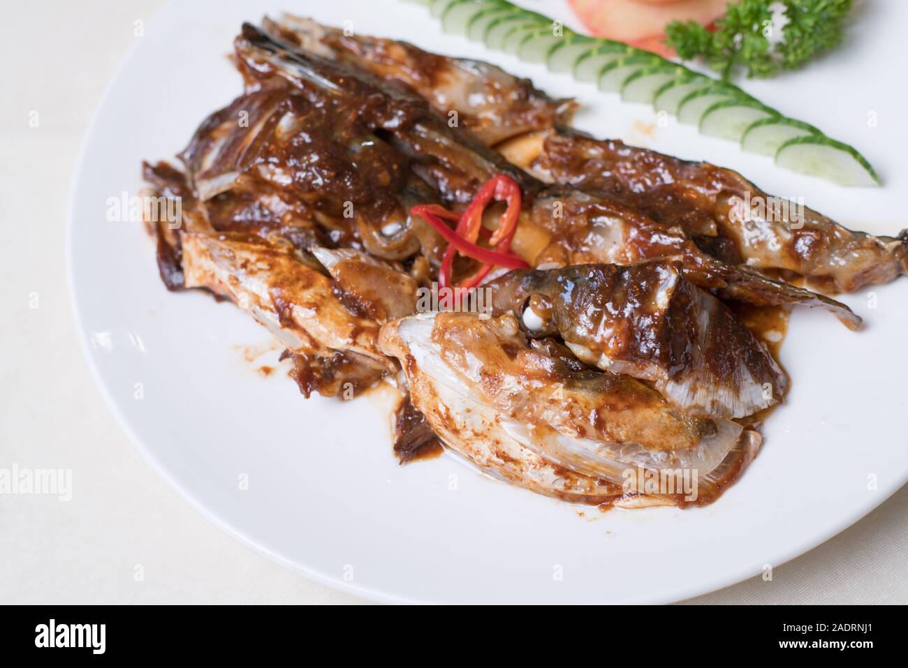 grilled mackerel(Saba) steak with teriyaki sauce and rice on white dish, popular japanese